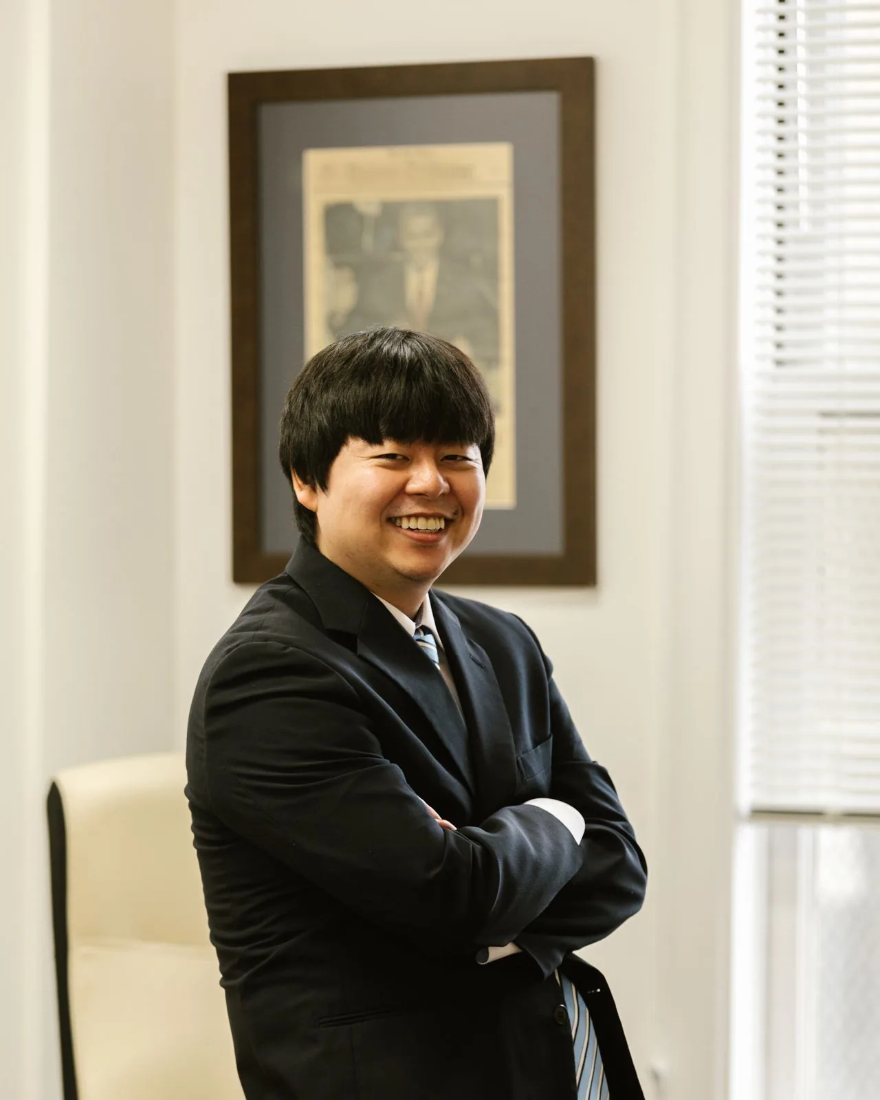 Compassionate Asian clinical psychologist representing Adlumina's high-end, confidential virtual therapy for clergy and religious